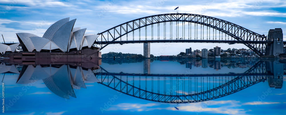 Wall mural Sydney Harbour Bridge at night NSW Australia reflection in the harbour waters