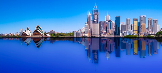 Panorama Sydney CBD skyline with reflection of buildings in the harbour waters 