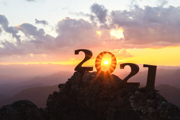 Silhouette of year 2021 with sunrise on mountain for New year success, Starting of New year concept.