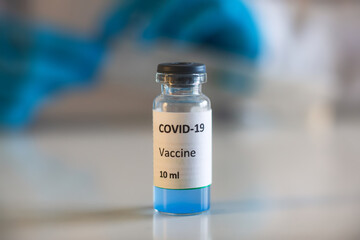 Concept of Covid 19 vaccine vaccinating, development and creation, doctor or scientist in...