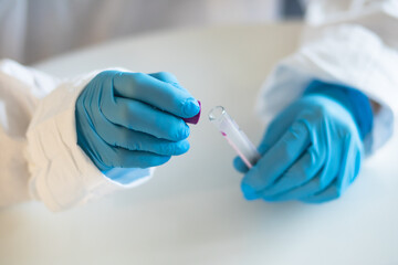 Process of coronavirus testing examination by nurse medic in laboratory lab, COVID-19 swab collection kit, test tube for taking OP NP patient specimen sample, patient receiving a corona test