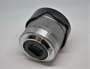 The lens for the camera on a dark background.