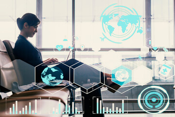 Social Media, Communication, Internet, Network Connection Concept - Side portrait of smiling asian businesswoman sitting with laptop, mobile phone and luggage at airpo