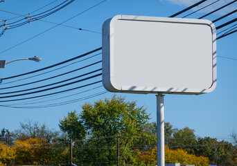 Large high blank business sign on a metal post by the side of a road