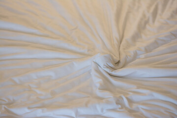 White linen background with copy space, Creased white cloth material fragment as a background, Top view of bedding sheets and pillow