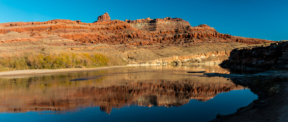 Fototapeta na wymiar Red Rock Cliffs Reflecting On The Lower Colorado River, Potash Road, Moab, Utah, USA