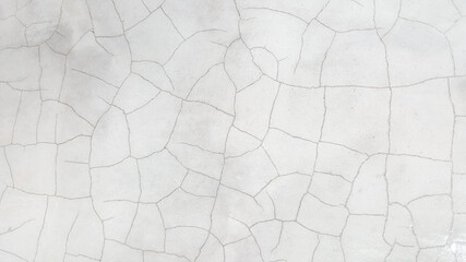 Close up crack white texture of concrete wall use for web design and abstract texture background