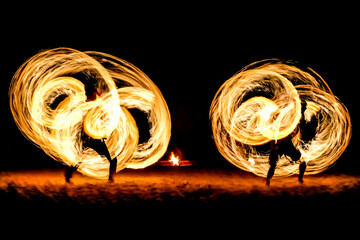 Blurry light of fire spinning at full moon night party use for web design and wallpaper background 