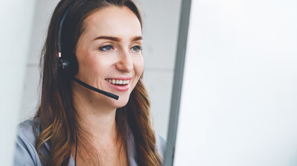 Business people wearing headset working in office to support remote customer or colleague. Call...