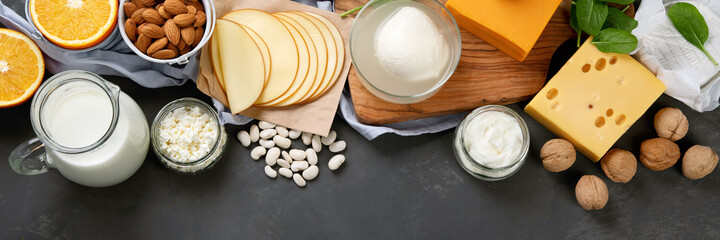 Healthy diary and non-diary products rich in calcium on dark background