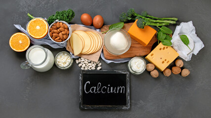 Healthy diary and non-diary products rich in calcium on dark background