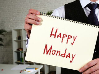 Happy Monday sign on the piece of paper.