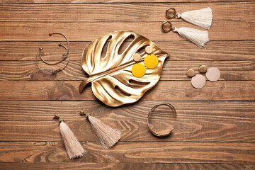 Beautiful jewelry on wooden background