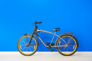 Modern bicycle against color wall