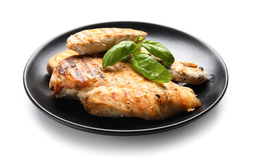 Plate with cooked chicken fillet on white background
