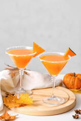 Glasses of tasty pumpkin pie martini on table