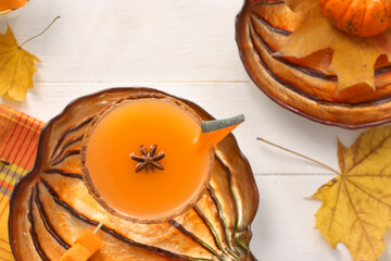 Glass of tasty pumpkin pie martini on table
