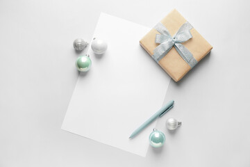 Blank letter to Santa and Christmas decor on light background