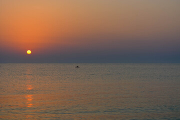 sun, sea and boat view from the beach 2