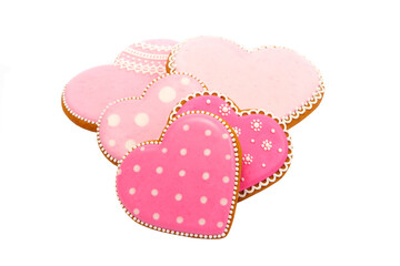 background from pink cookies heart shaped with different patterns, isolated