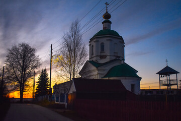 Beautiful village church at sunset