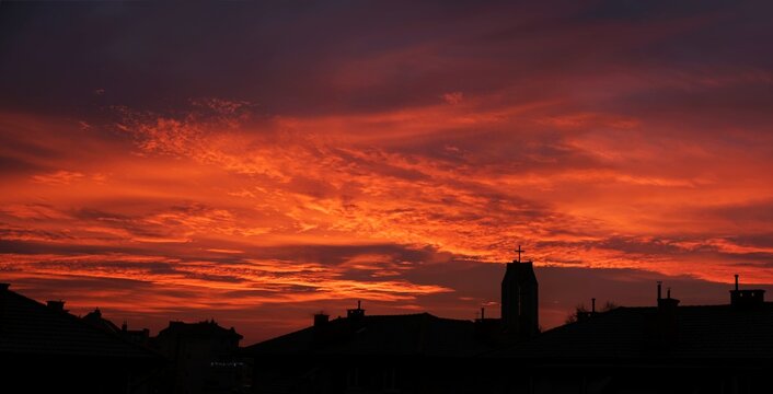 Amazing Red Sunrise Sky With Clouds Over City