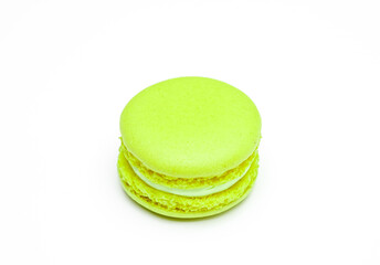 Green french macaroons on white background