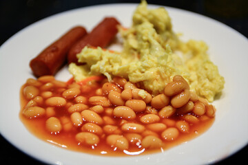 baked beans white blurry omelette and sausage