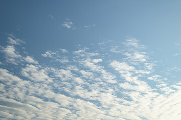 Naklejka na ściany i meble White clouds on blue sky