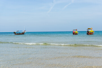 Fototapeta na wymiar Beautiful boat on white sand beach, Phuket Thailand.