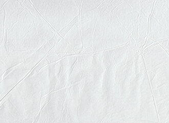 White crumpled wrapping paper. Wrinkled. Creased. Background