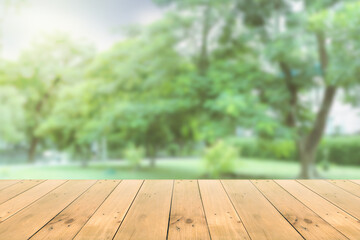 Empty wooden board empty table in front of blurred background. Perspective brown wood over wind nature background - can be used mockup for display or montage your products. copy space.