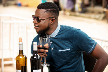 handsome young man drinking red wine