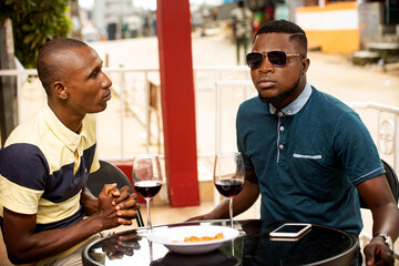 two young people talking outside