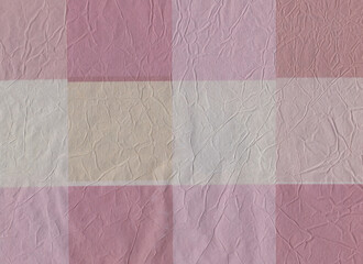 Pink colored crumpled wrapping paper. Checkered. Wrinkled. Creased. Background. Various pink colors: light pink, old pink. White. Light Yellow. Pastel colors. 