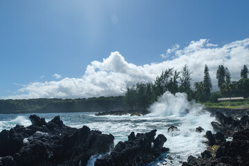 a rocky beach with a waterfall