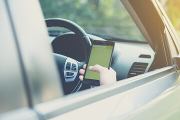 check his smartphone in a moving car