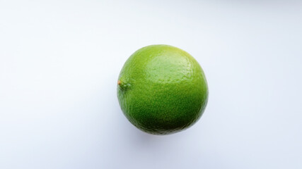 Green fresh tasty lime on a white background with a clean texture