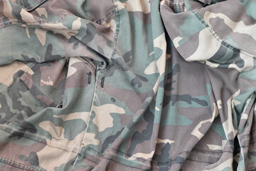 Camouflage background texture as backdrop for paintball and airsoft strikeball design projects