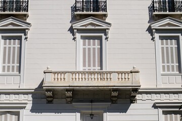 White high ceiling vintage building with beautiful balcony, Athens, Greece