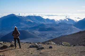 Fototapeta premium a person standing on a mountain