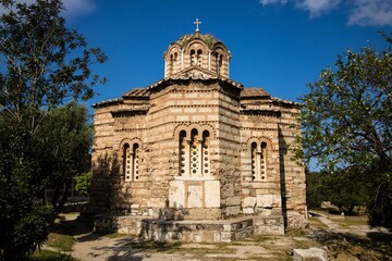 Fototapeta na wymiar Small Byzantine church during summer day, blue sky, Ancient Agora, Athens, Greece