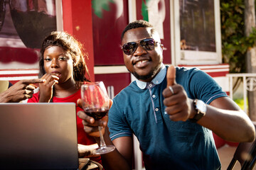 young group of friends drinking a glass of red wine