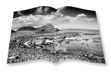 Irish landscape in northern Ireland (County Antrim - United Kingdom) - 3D render concept image of an opened photo book isolated on white - I'm the copyright owner of the images used in this 3D render