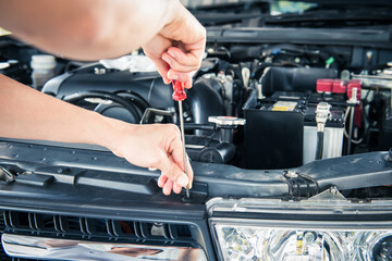 The mechanic is checking the engine