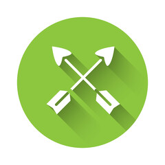 White Crossed arrows icon isolated with long shadow. Green circle button. Vector.
