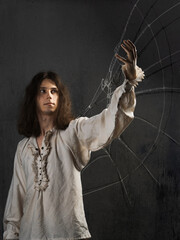 young man in medieval clothes in the image of Da Vinci, dreams of flight,