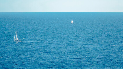 Two Sailing boats in the Adriatic Sea. Blue Adriatic sea with two sailing boats shot in Dubrovnik Croatia