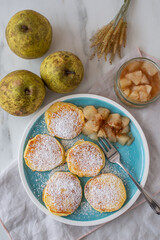 home made pancakes with cooked pears on a table