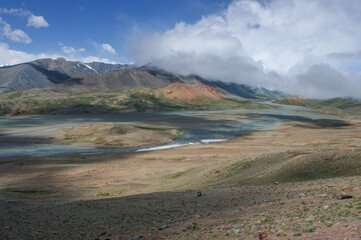 Stunning pastel colors of high-altitude mountain landscape along the Pamir Highway close to Kyzyl Art border in the high mountains of Gorno-Badakshan, Murghab district, Tajikistan